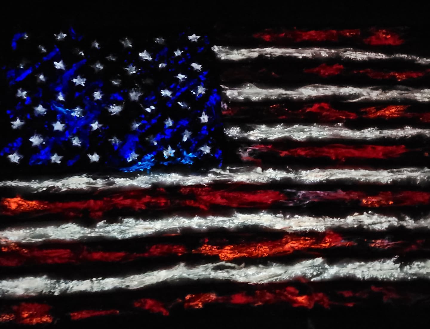 Glowing American flag painting photographed against a dark background