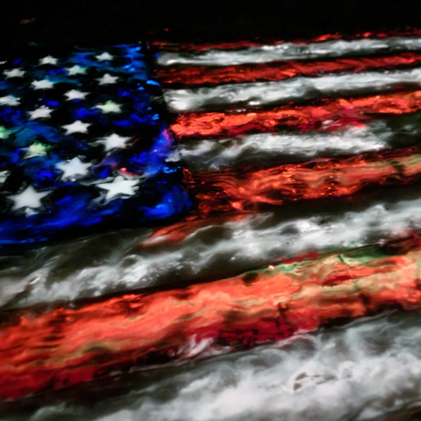 American flag artwork glowing red and white under different lighting