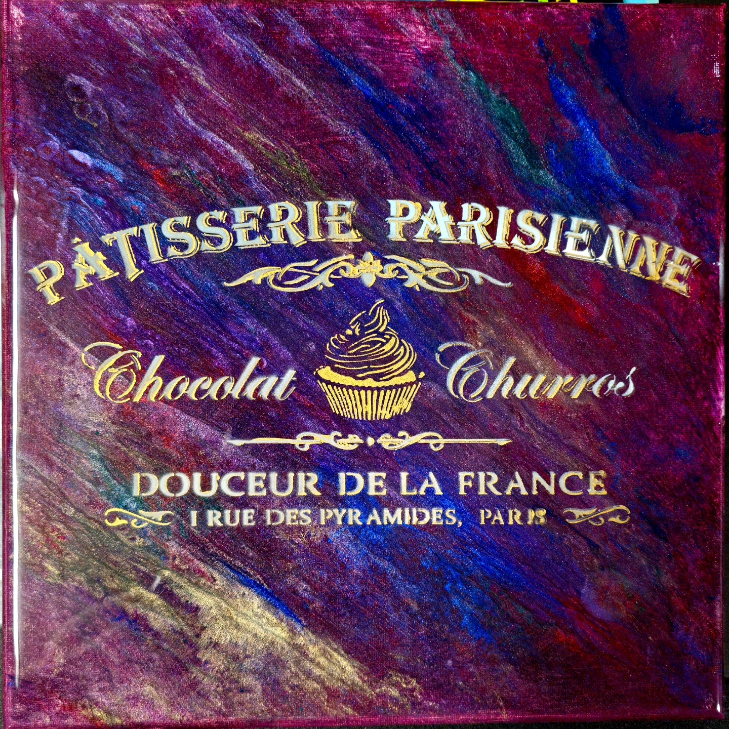 Gold Parisian patisserie stencil over pink and purple texture