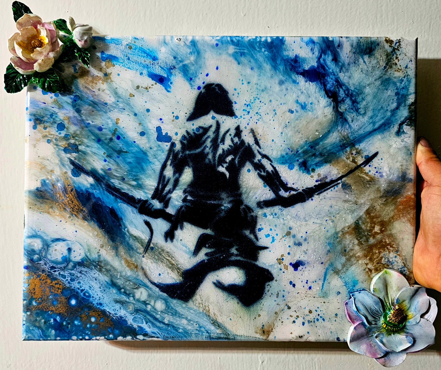 Seated samurai stencil amid blue and white painted textures