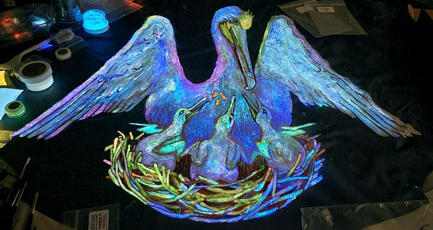 Landin’s Louisiana state flag artwork: a pelican and its young glowing under UV light